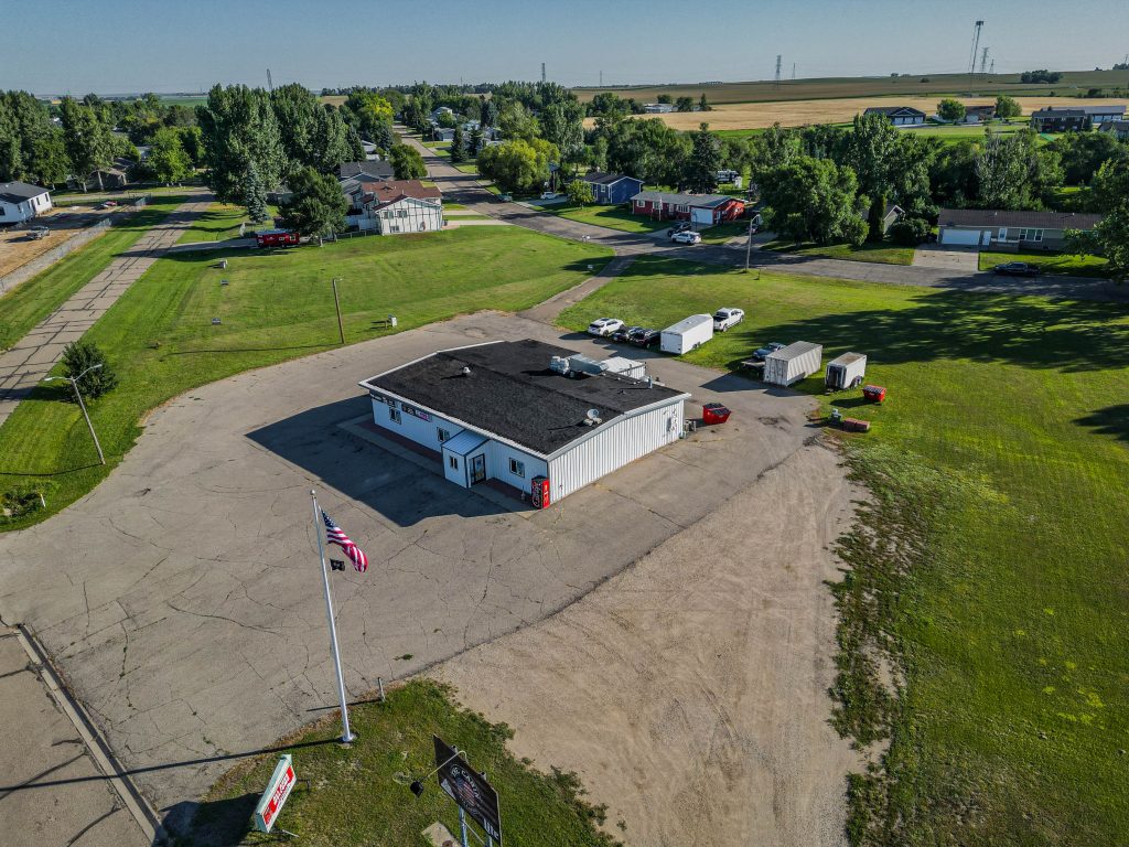 Commercial building for sale at 1608 Dakota Drive in Washburn with four surrounding development lots