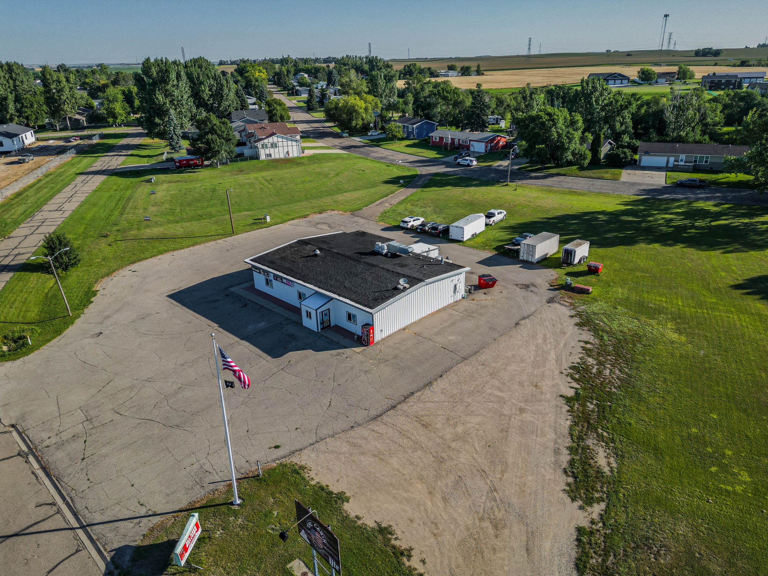 Commercial building for sale at 1608 Dakota Drive in Washburn with four surrounding development lots